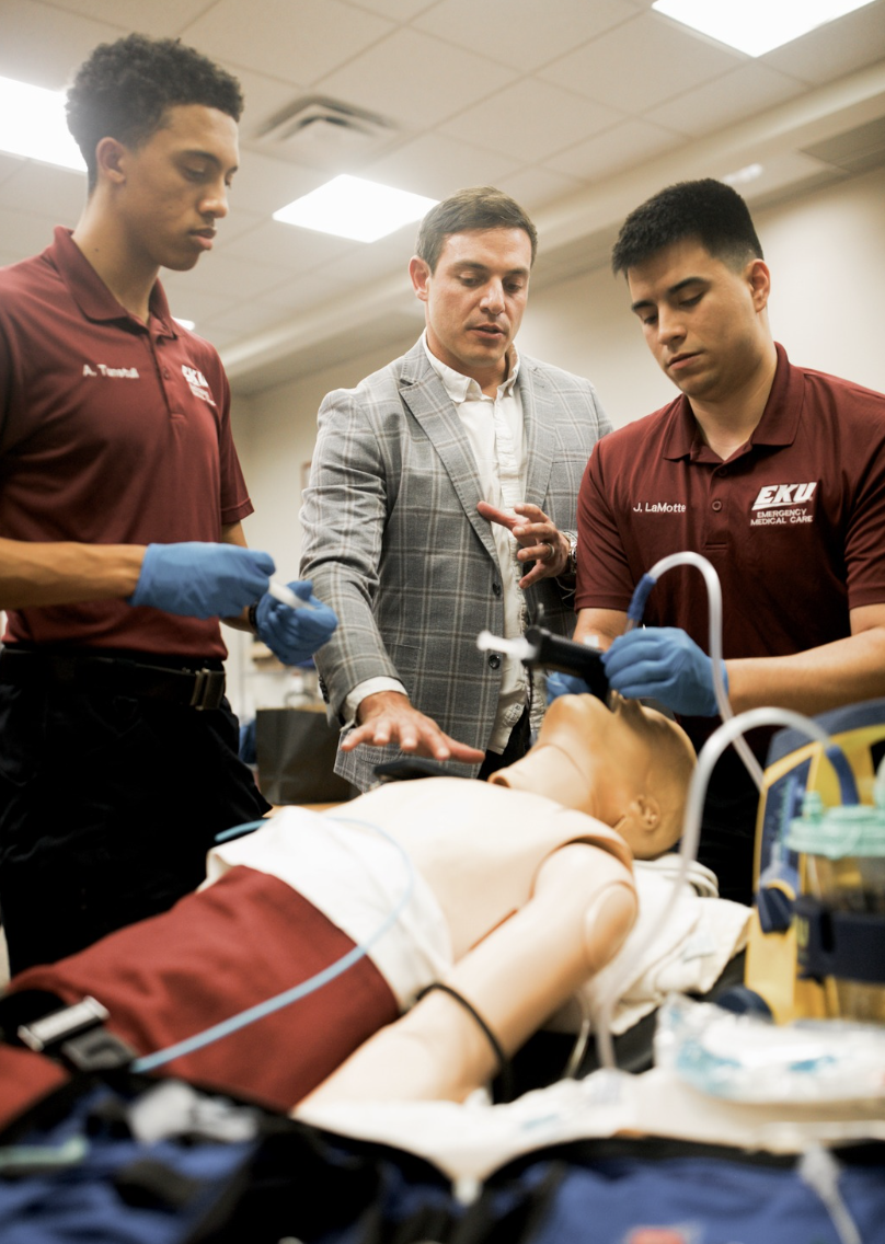 EMS educator leading a group of students through an airway training session